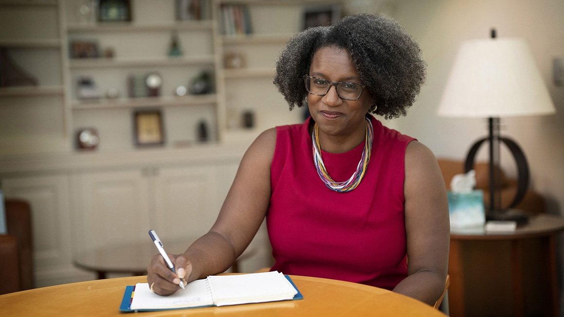 Dean Rowley sitting at a desk